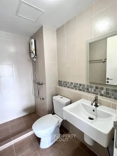 Modern bathroom with sleek fixtures and tiled walls