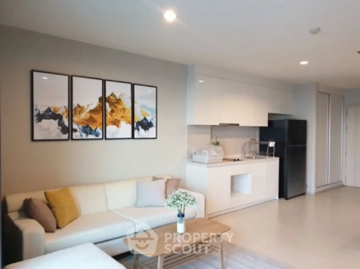 Modern living room with stylish decor and open kitchen layout