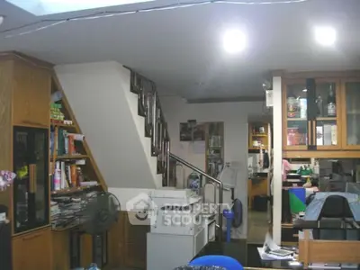 Cozy home office with staircase and built-in storage