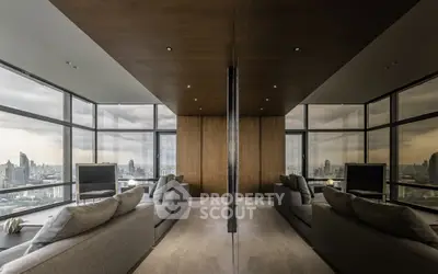 Luxurious high-rise living room with panoramic city views and modern decor