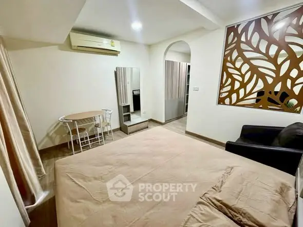 Spacious bedroom with modern decor and air conditioning