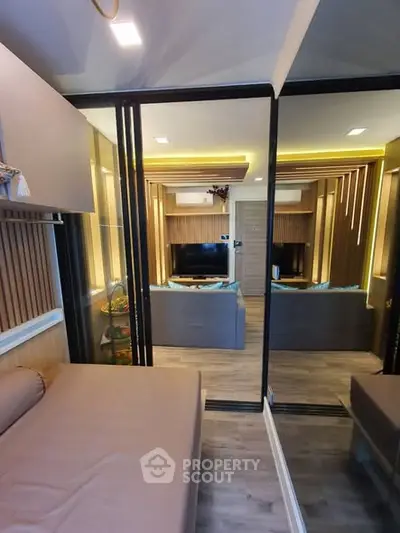 Modern living room with stylish decor and mirrored walls