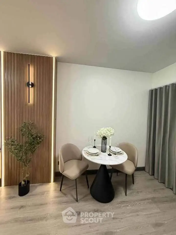 Stylish dining area with modern decor and elegant lighting, perfect for intimate gatherings.