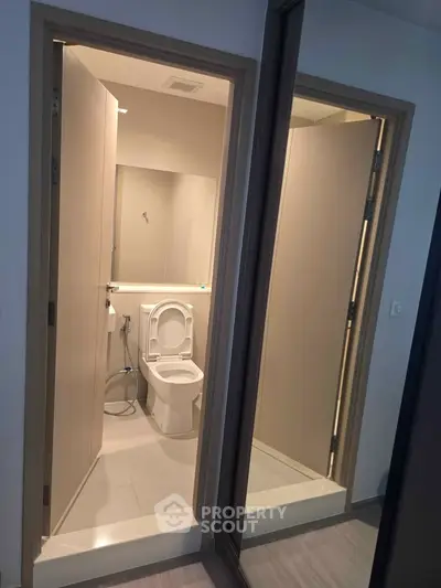 Modern bathroom with sleek design and contemporary fixtures in a stylish apartment.
