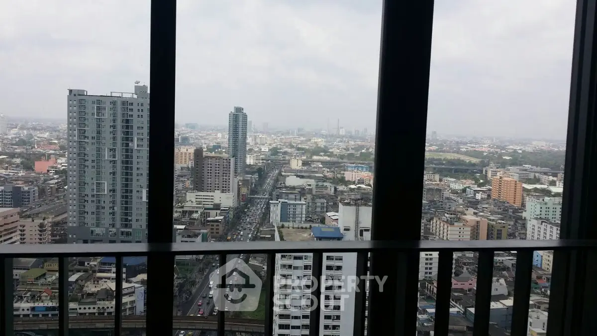 Stunning cityscape view from high-rise balcony showcasing urban skyline and bustling streets.