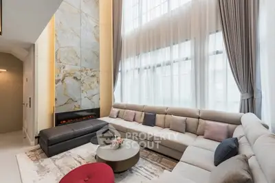 Luxurious living room with high ceilings and elegant decor