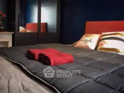 Cozy bedroom with stylish decor and plush bedding for ultimate relaxation.