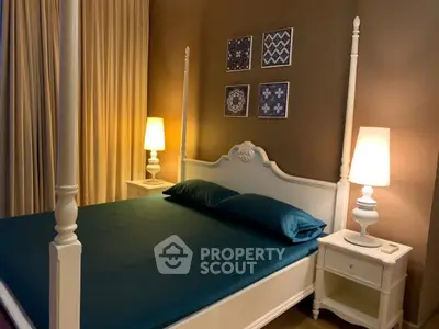 Elegant bedroom with stylish decor and warm lighting, featuring a classic four-poster bed.