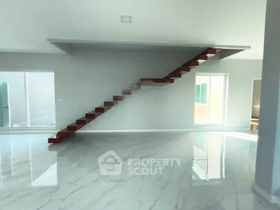 Modern minimalist interior with sleek staircase and glossy marble flooring