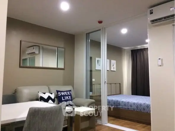 Modern studio apartment with cozy living area and stylish bedroom