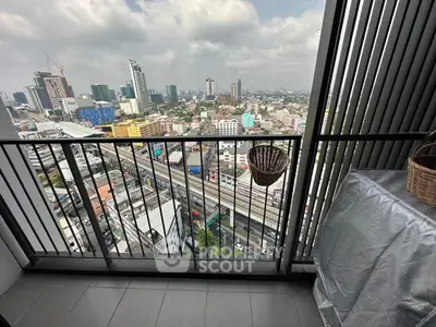 Stunning cityscape view from a high-rise balcony with modern railing and urban skyline.