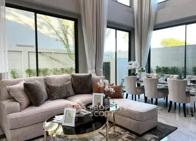 Luxurious living room with elegant dining area and large windows