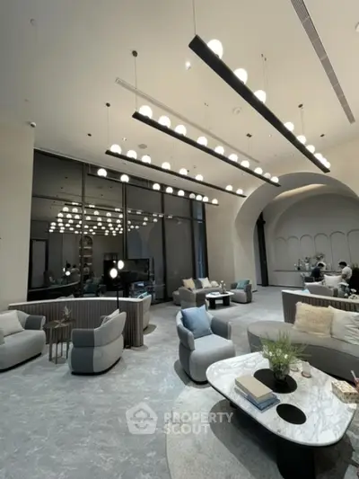 Luxurious modern living room with high ceilings and elegant lighting