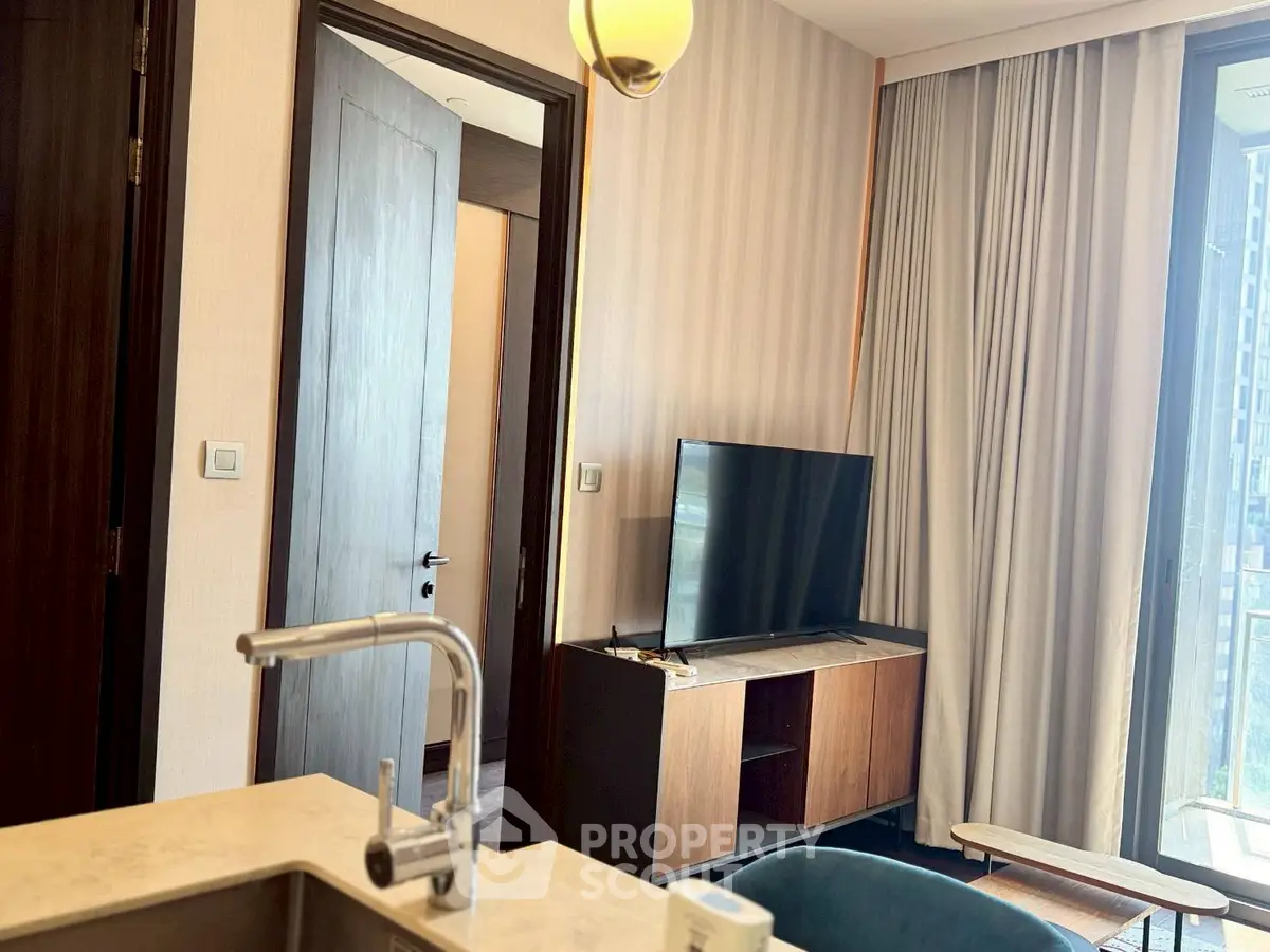 Modern living room with sleek TV stand and elegant curtains