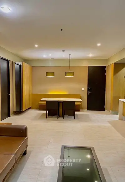 Spacious modern living room with elegant lighting and stylish furniture