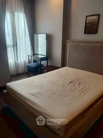 Cozy bedroom with natural light and elegant decor