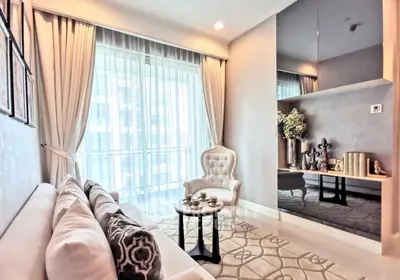 Elegant living room with plush seating and stylish decor in modern apartment