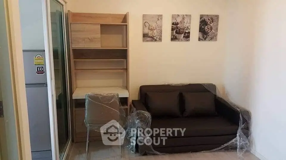 Cozy living room with modern furniture and stylish wall art, perfect for relaxation and comfort.