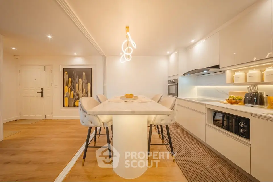 Modern kitchen with sleek white cabinets and stylish island seating
