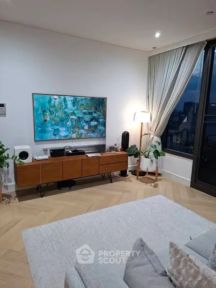 Stylish living room with modern decor and large window view