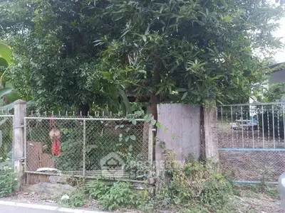 Charming rustic property with lush greenery and fenced yard, perfect for nature lovers seeking tranquility.