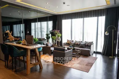 Luxurious modern living room with elegant decor and large windows