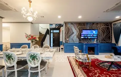Luxurious living room with elegant dining area, stylish decor, and modern amenities for sophisticated living.