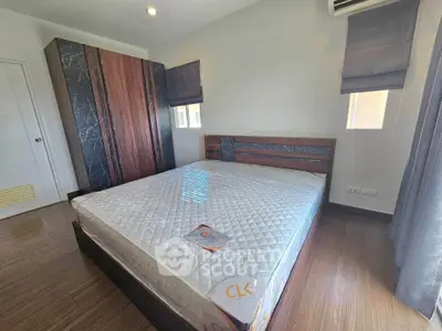 Modern bedroom with stylish wooden furniture and natural light