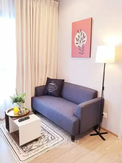 Cozy living room with modern sofa and stylish decor, perfect for relaxation.