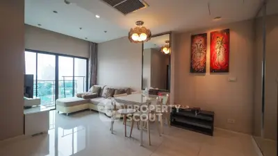 Modern living room with stylish decor and city view balcony