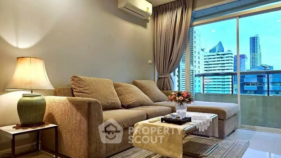 Modern living room with city view, cozy sofa, and elegant decor in urban apartment.