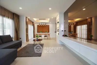 Spacious modern living room with elegant decor and ample natural light