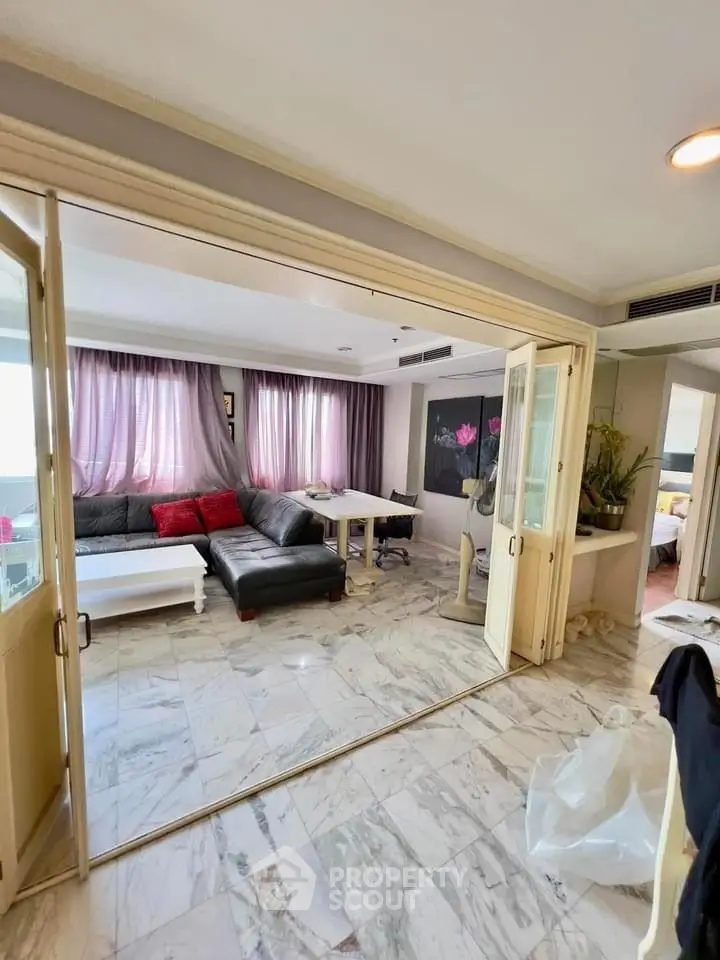 Spacious living room with marble flooring and stylish decor