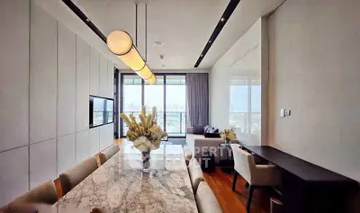 Luxurious modern living room with stunning city view and elegant marble dining table.