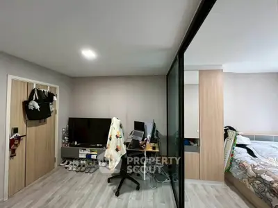 Modern bedroom with workspace and sliding glass doors