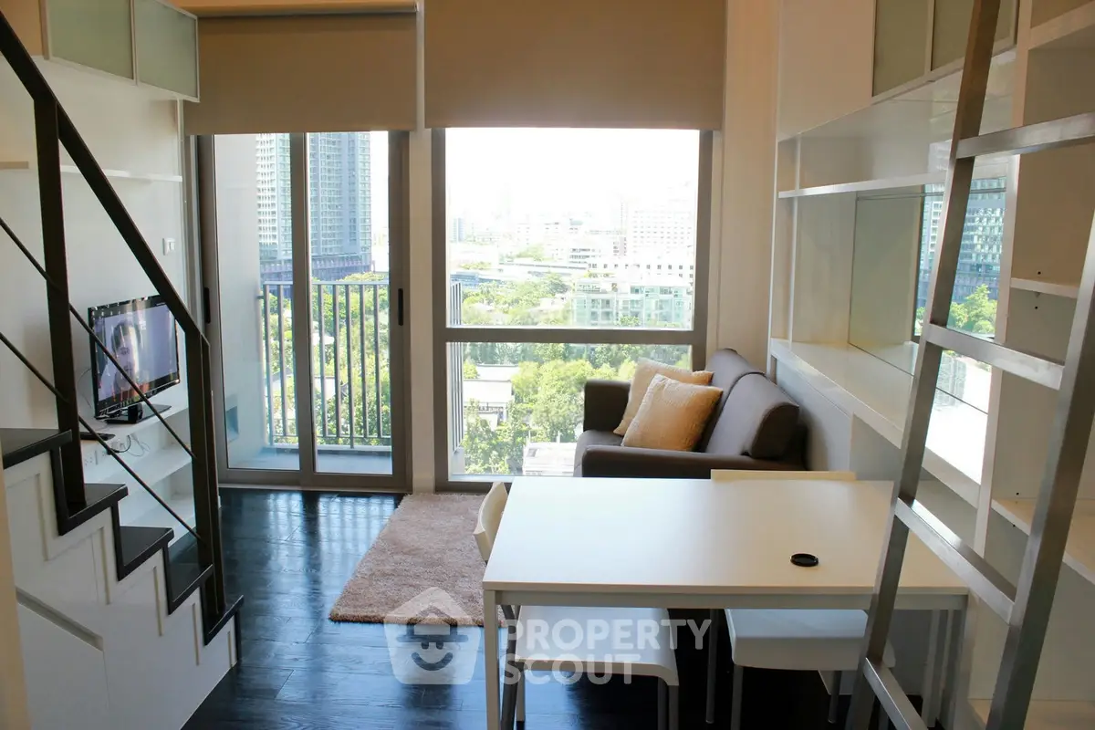 Modern living room with loft design, large windows, and city view in a stylish apartment.