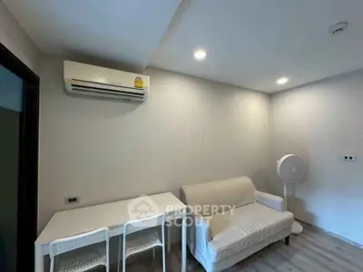 Modern living room with air conditioning and minimalist furniture