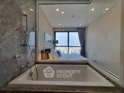 Luxurious bathroom with city view from bathtub, modern design and elegant finishes.