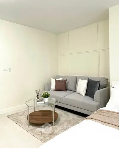 Modern living room with cozy gray sofa and stylish coffee table
