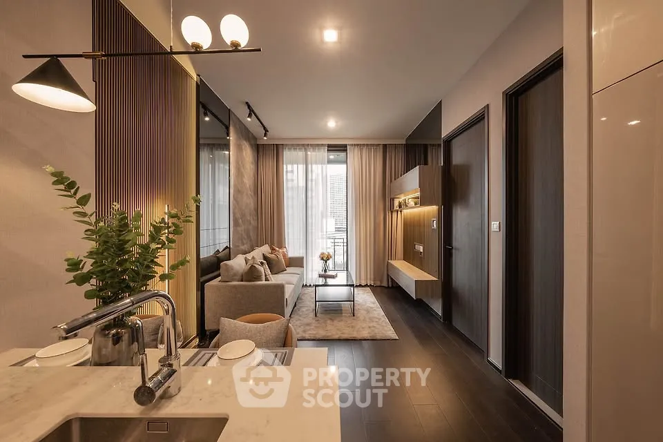 Modern open-layout living room with elegant decor and natural light