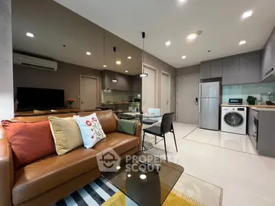 Modern open-plan living room with stylish kitchen and cozy seating area