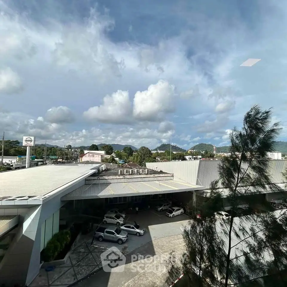 Stunning view of modern building with clear blue sky and lush greenery.