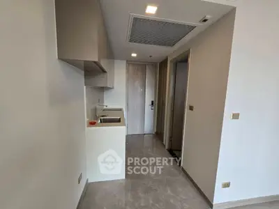 Modern compact kitchen with sleek cabinetry and minimalist design