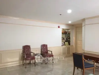 Spacious interior with elegant chairs and decorative shelving