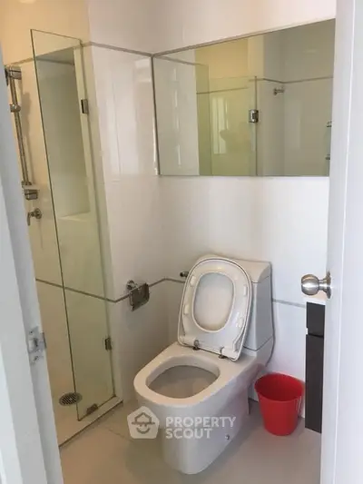 Modern bathroom with glass shower and sleek toilet design