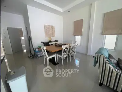 Spacious living room with modern dining area and stylish decor