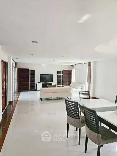 Spacious living room with modern furniture and natural light