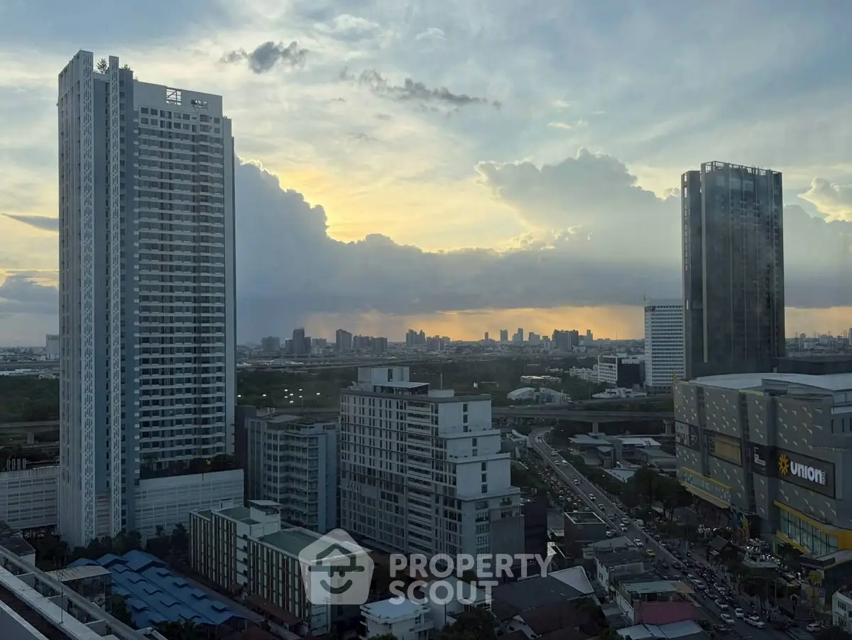 Stunning cityscape view with modern high-rise buildings at sunset, perfect for urban living enthusiasts.