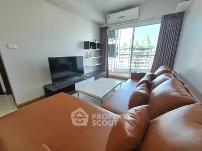 Modern living room with leather sofa and city view balcony