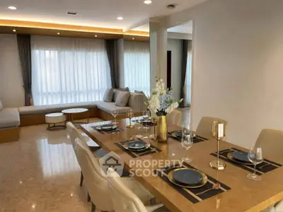 Luxurious dining and living area with elegant decor and ample natural light